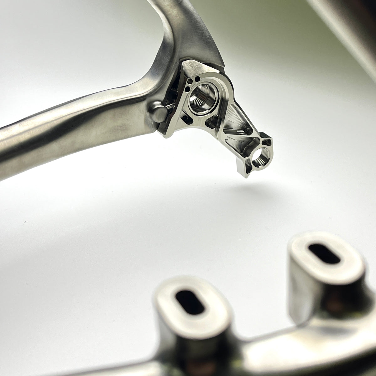 Hot Check x TiParts Titanium Universal Rear Derailleur Hanger (UDH RD Hanger) | Shimano & SRAM