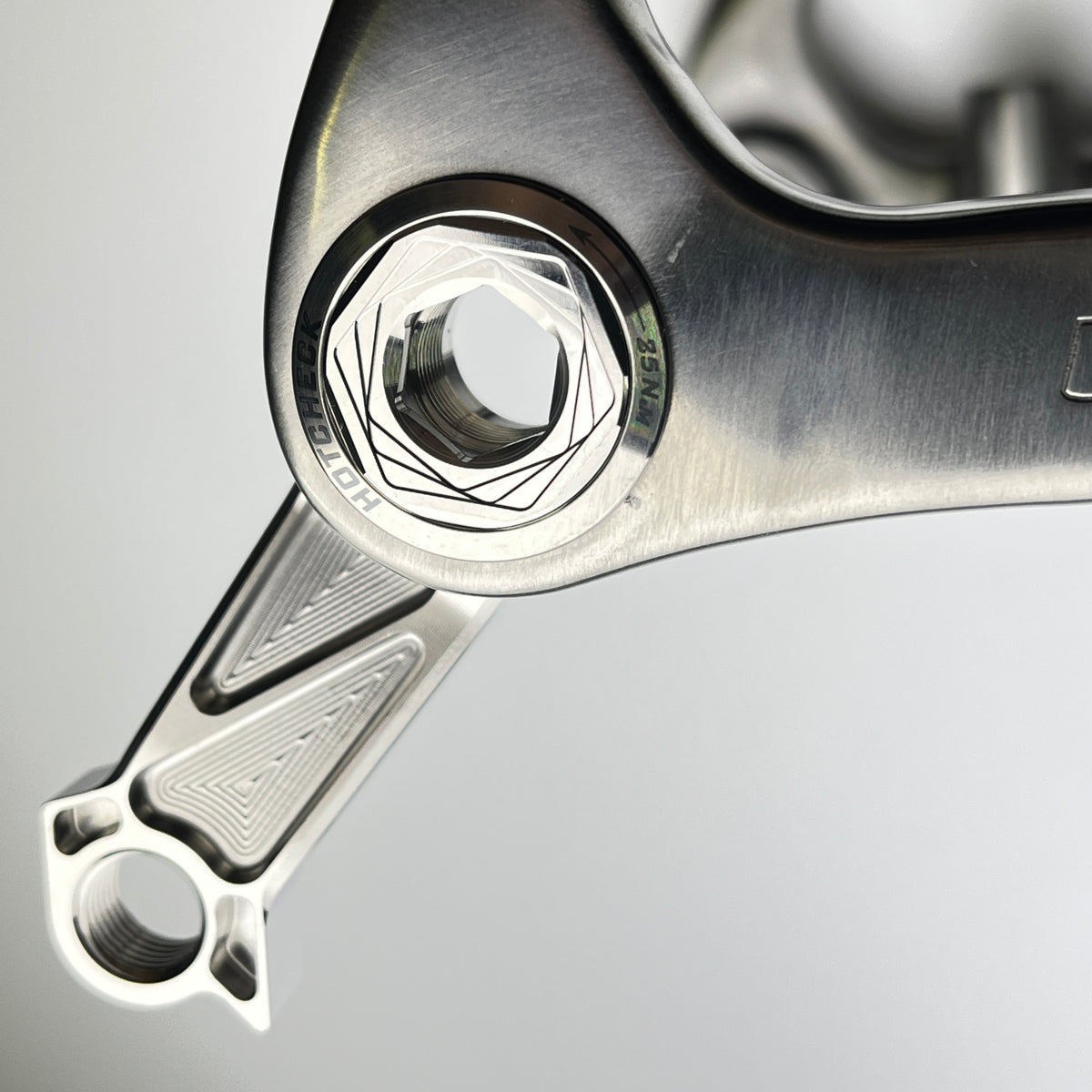 Hot Check x TiParts Titanium Universal Rear Derailleur Hanger (UDH RD Hanger) | Shimano & SRAM