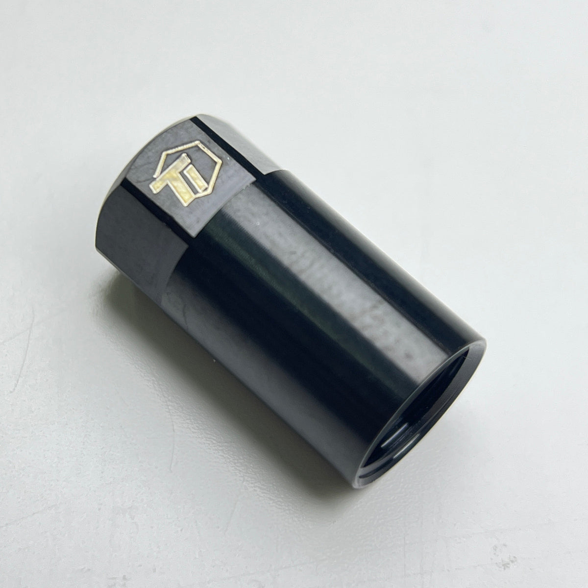 Nitride black cylindrical titanium hose fitting
