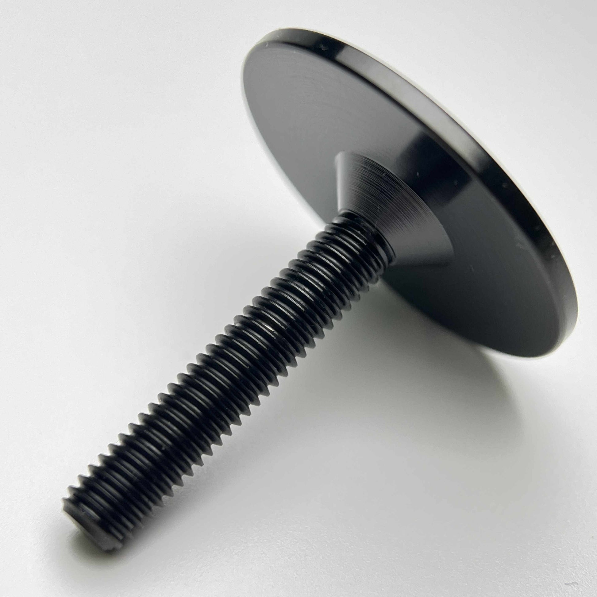 One-piece titanium stem cap and bolt nitride black